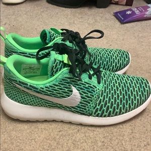 Green and black Nike sneakers